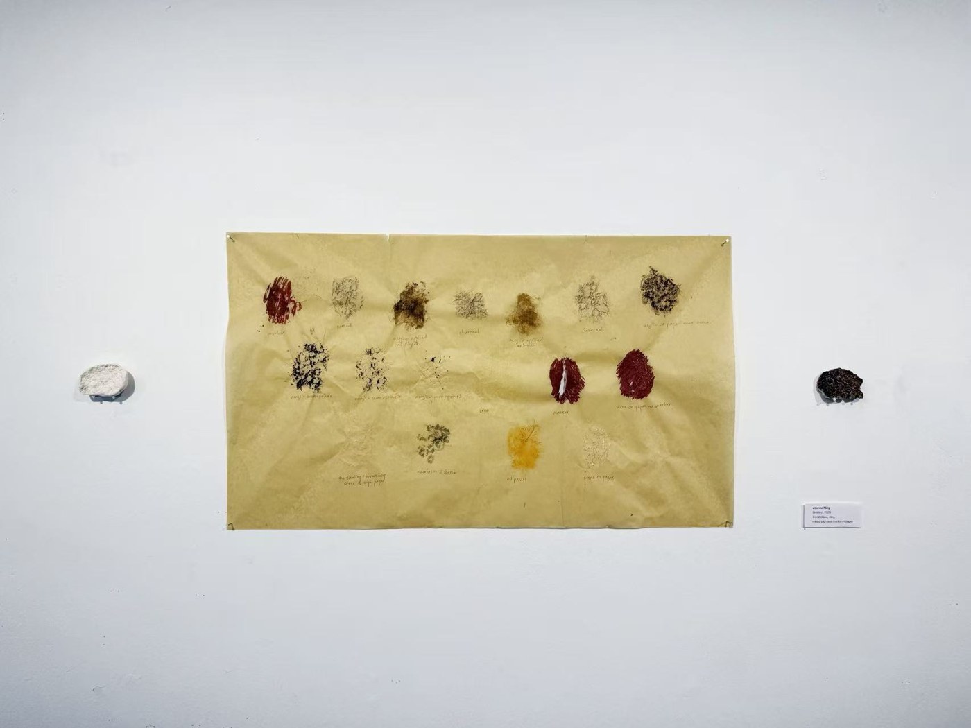 Joanne Ning
Untitled, 2026
Coral stone, clay, mixed pigment marks on paper
